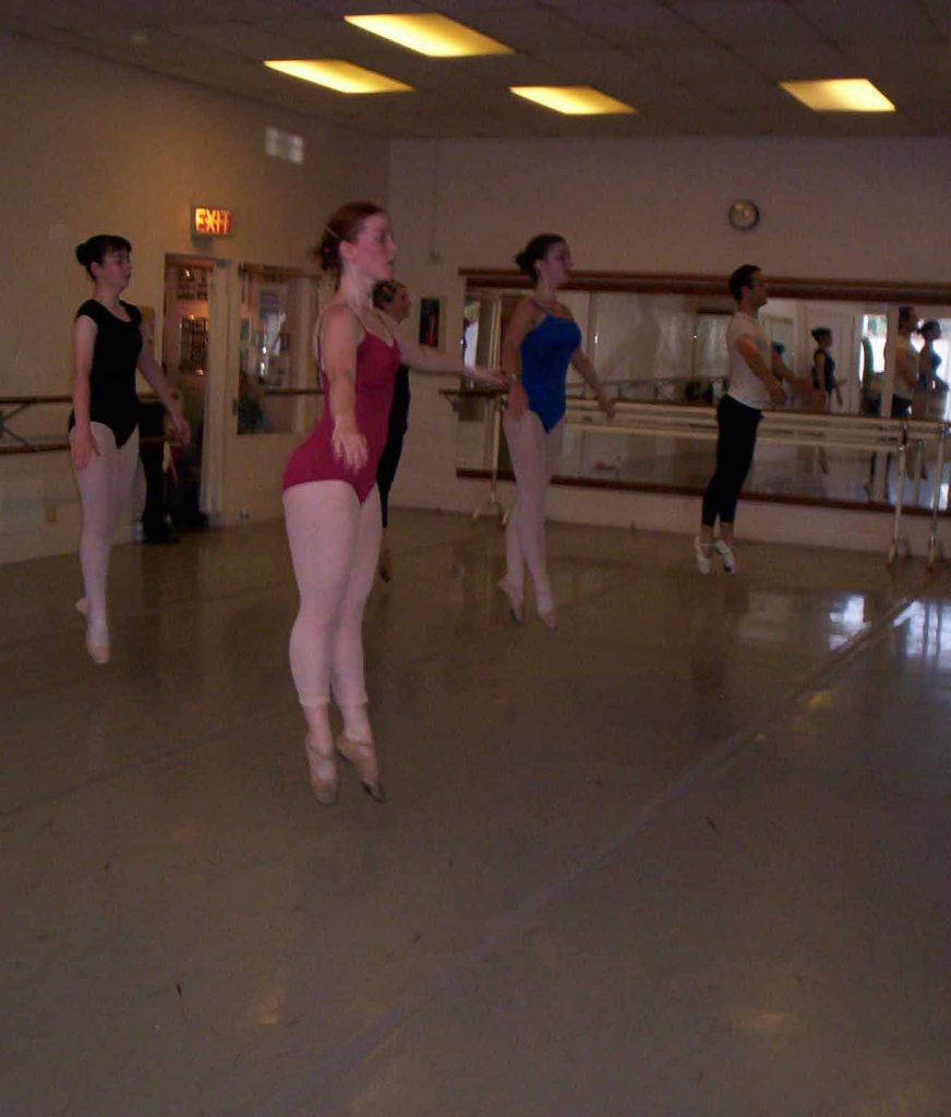 Dancers in class mid petit allegro