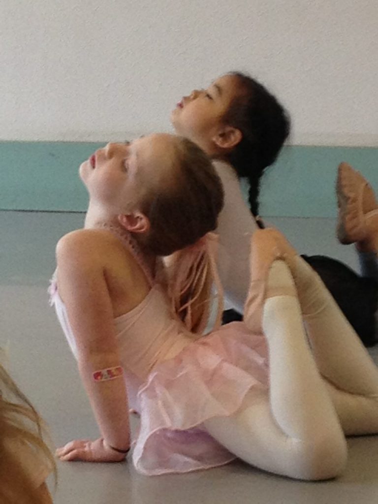 Two young dancers stretch in Serendipity