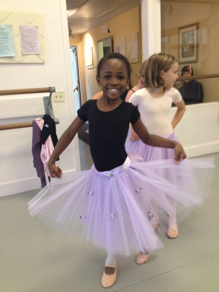 Young dancers in purple shirts in the studio