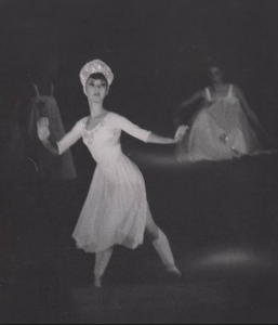 Scan of a photograph of Andra Corvino performing in the Waltz of the Snowflakes variation of the Nutcracker.
