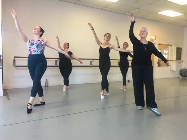 Adult dancers pose with Beth Hoge, Danspace's founder.